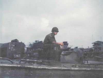 Cat Lai 7/15/1969  Elwood sitting on his bridge boat